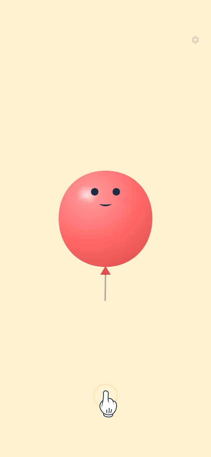 The child's screen: a red balloon with a face on a cream background, with a pointing glove below as a hint